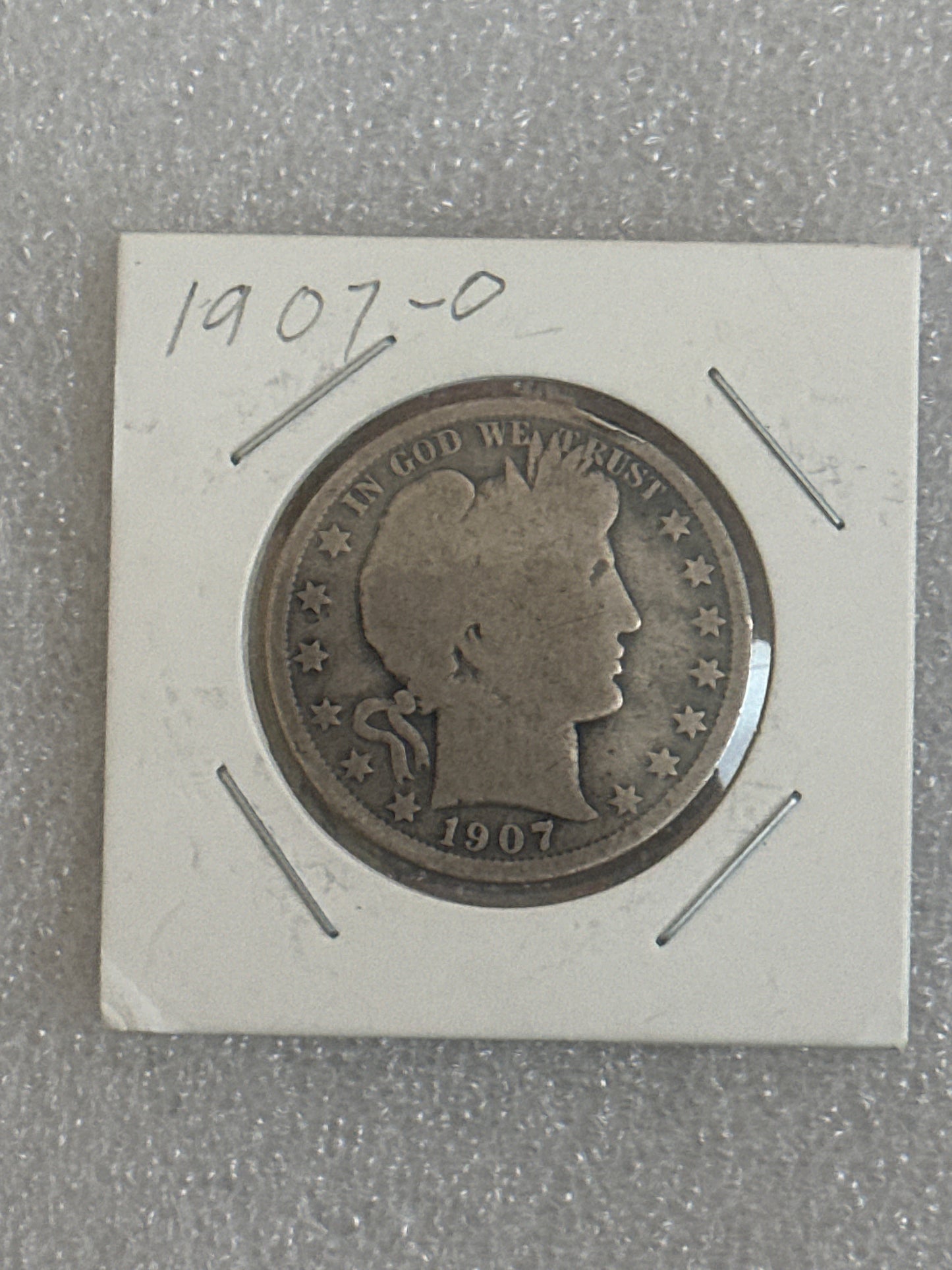 1907 O Morgan silver half dollar